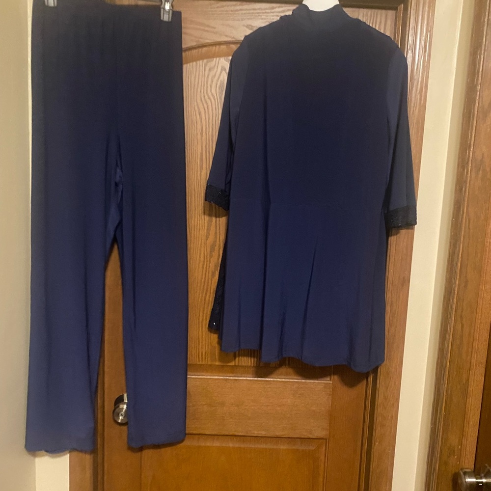 Woman’s pant suit, Navy blue, light sequence on front.